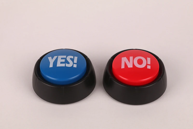 Two buzzer buttons side by side: a blue one that says YES! and a red one that says NO!
